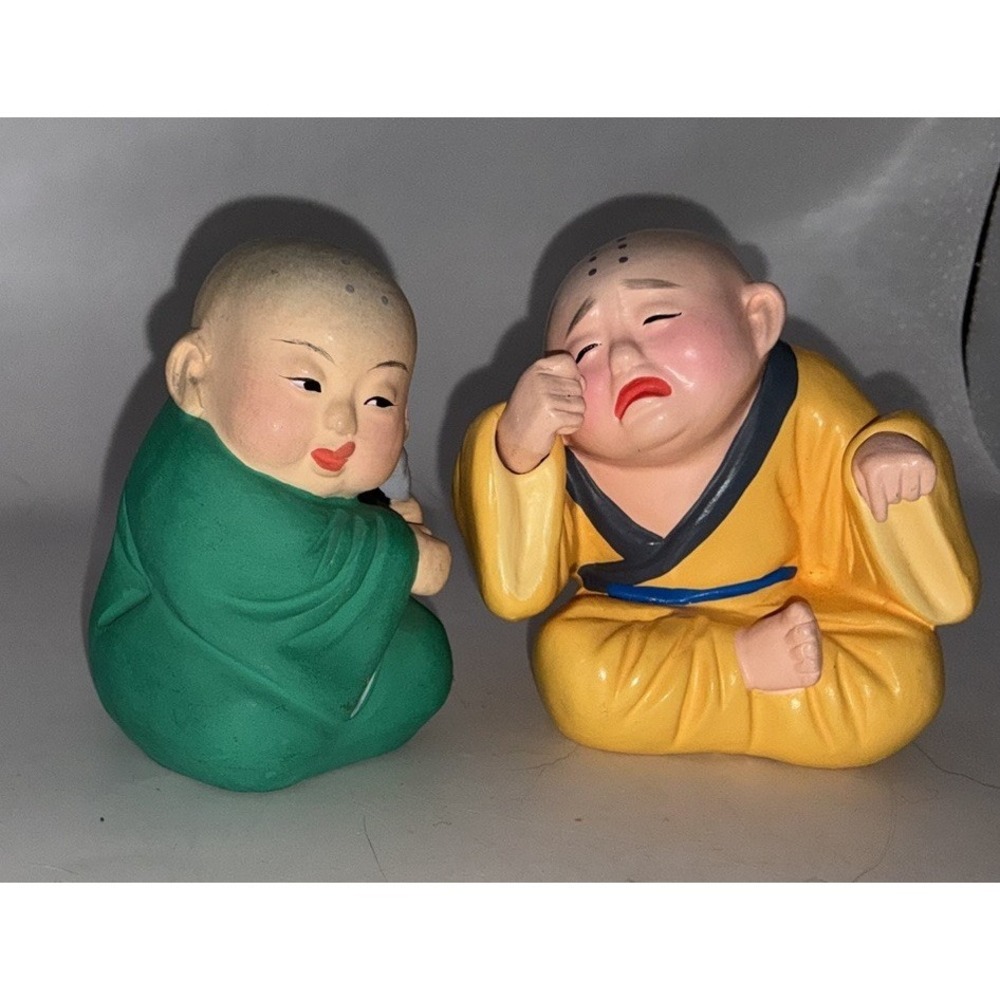 Pair Of Monk Baby Figurines